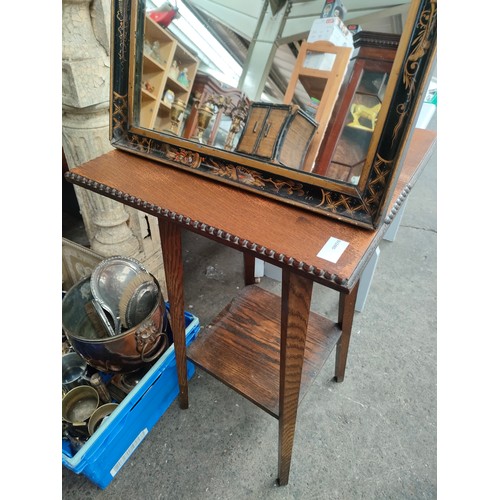 66 - 1930s oak table along with a Chinese lacquered framed mirror.