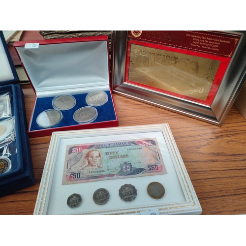 383 - Selection of British commemorative coins, gold bank note etc