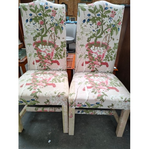 422 - A pair of chairs in a floral material