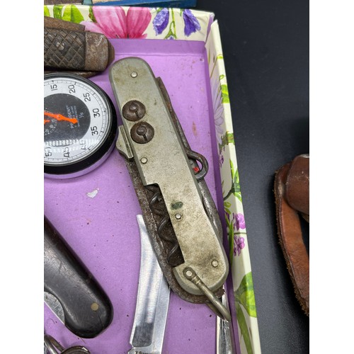 32 - A Tray containing a collection of fruit knives, Military knives and advertising tins- Sullivan Powel... 