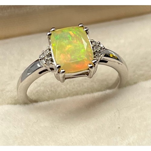 37 - 10ct white gold ladies ring set with a Ethiopian Opal off set with diamond shoulders. [3.01grams] [R... 