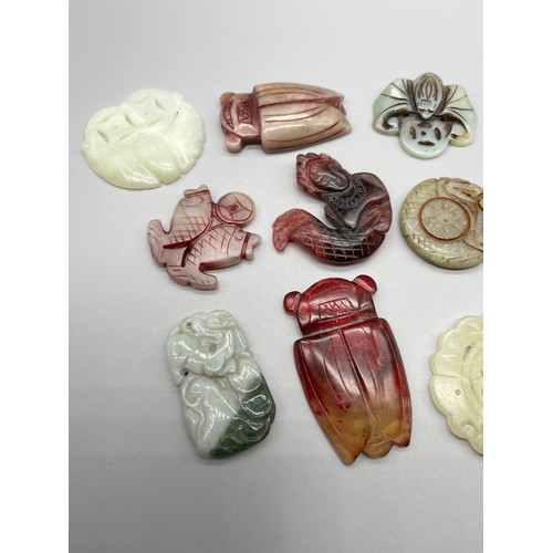 57 - A Collection of Chinese hand carved jade and stone carved sculptures.