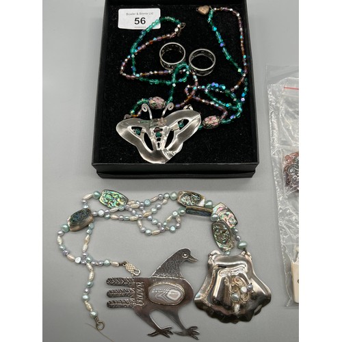 56 - A Selection of hand made silver jewellery to include Silver hand made rings, Pendants and brooch, Co... 