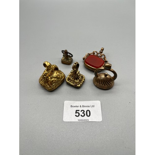 530 - A Lot of five antique gilt metal fobs and seals.