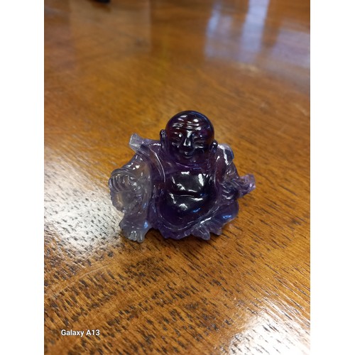 541 - Antique Chinese hand carved sculpture of a sitting buddha- carved from an amethyst stone. [4cm high]