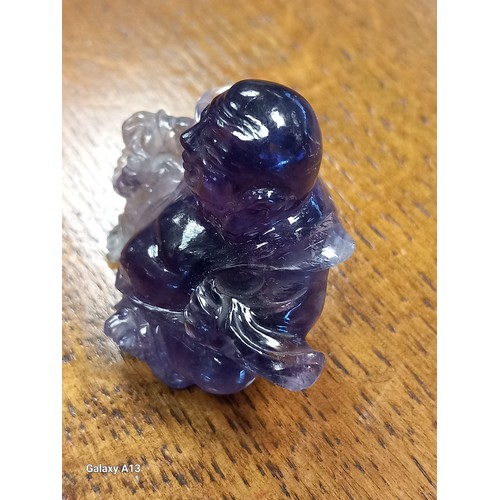 541 - Antique Chinese hand carved sculpture of a sitting buddha- carved from an amethyst stone. [4cm high]