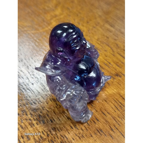 541 - Antique Chinese hand carved sculpture of a sitting buddha- carved from an amethyst stone. [4cm high]