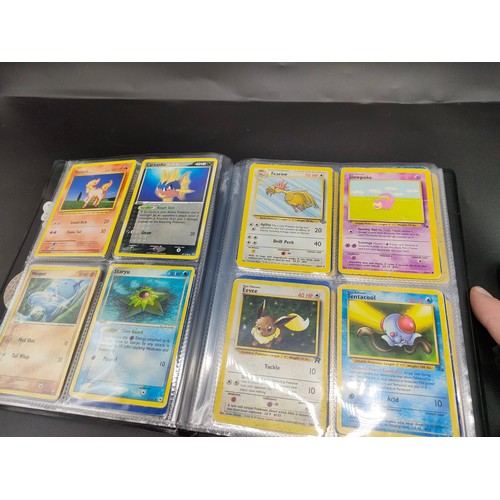 101 - Album of Pokemon cards to include Mew, Pikachu, Moltres, Raichu, Fearow and many more