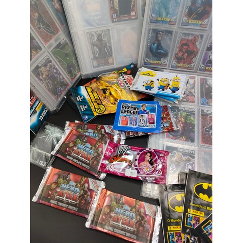 105 - Five albums of Marvel Avengers collectors cards and a large selection of sealed packs of collectors ... 