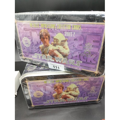 111 - Two sealed tins of Star Wars 'The Empire Strikes Back' metallic impressions collector cards and star... 