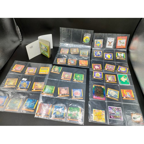 112 - Small album of various Pokémon cards and five sleeves of Pokémon Artbox stickers