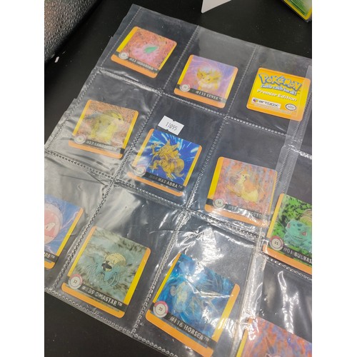 112 - Small album of various Pokémon cards and five sleeves of Pokémon Artbox stickers