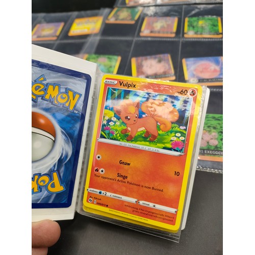 112 - Small album of various Pokémon cards and five sleeves of Pokémon Artbox stickers