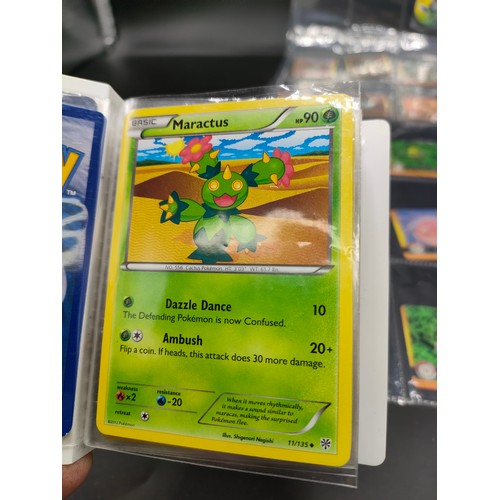 112 - Small album of various Pokémon cards and five sleeves of Pokémon Artbox stickers