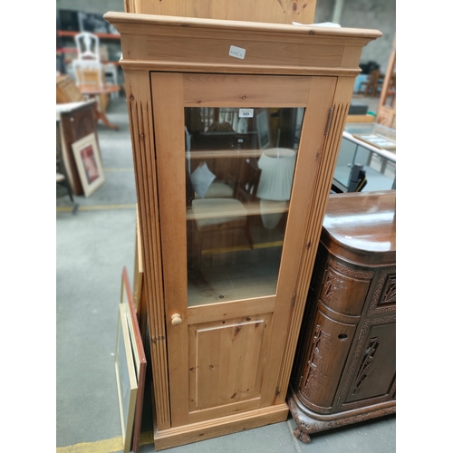 151 - A Slimline pine single cabinet