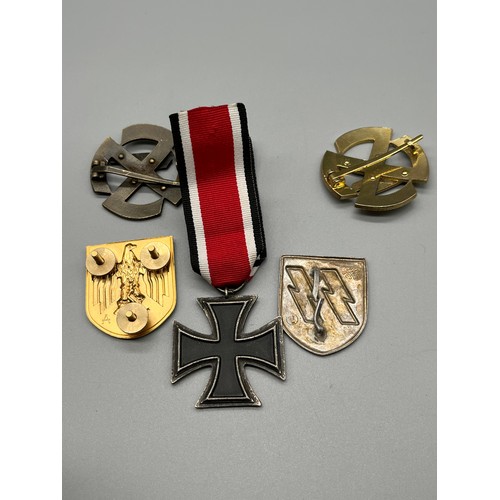 162 - A Selection of reproduction Military German badges.