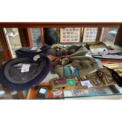 160 - A Shelf of military and girl guide collectables to include two model ship boats, leather child's spo... 