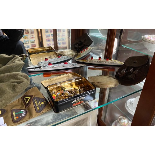 160 - A Shelf of military and girl guide collectables to include two model ship boats, leather child's spo... 