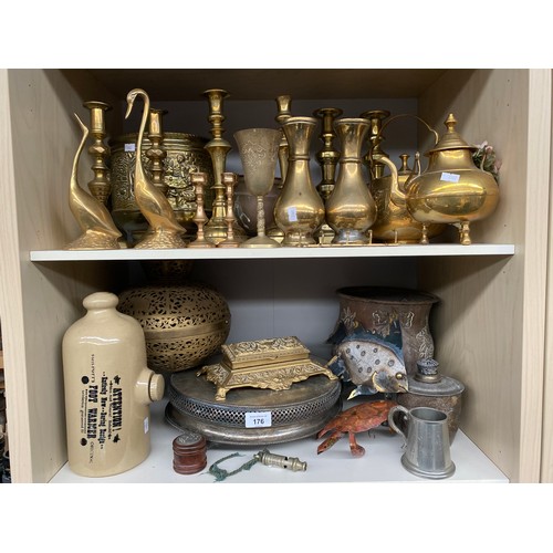 176 - Two Shelves of collectables to include brass candles sticks, Vases, Brass pierced Indian hanging lig... 