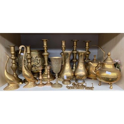 176 - Two Shelves of collectables to include brass candles sticks, Vases, Brass pierced Indian hanging lig... 