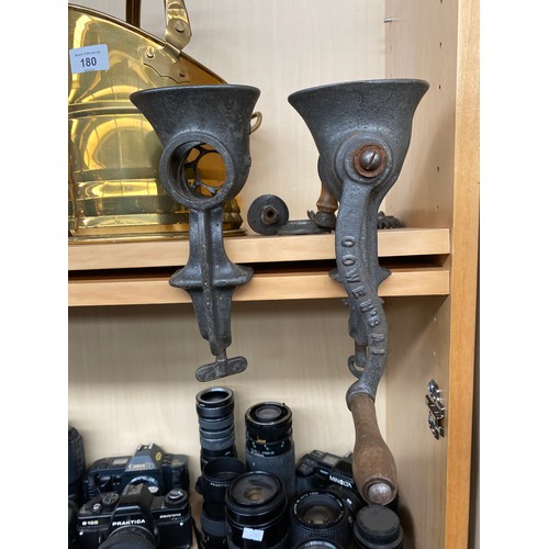 180 - A Shelf of collectables to include two metal Corinthian column candle sticks, Brass helmet coal scut... 