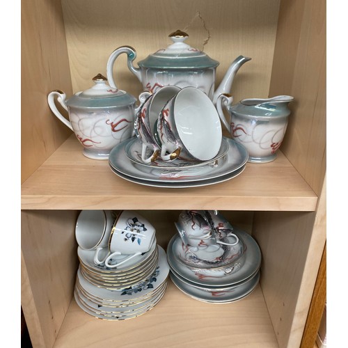 183 - Four shelves of vintage tea sets to include Chinese Dragon design and Geisha tea service & two Royal... 