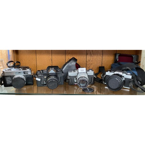 200 - Shelf of cameras to include Minolta 7s, Topcon RM300, Minolta SRT101 AND XG-1.