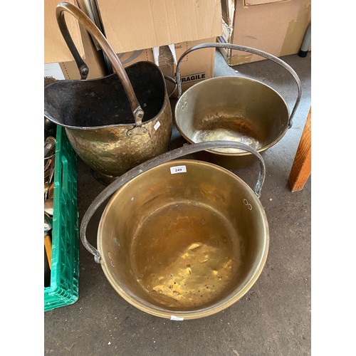 249 - Two brass jelly pans and brass helmet coal scuttle.