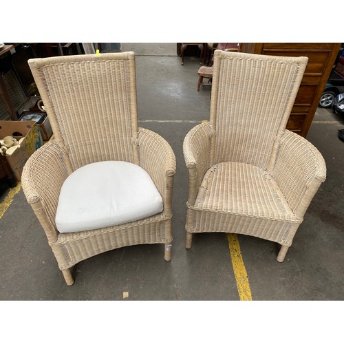 256 - A Pair of contemporary wicker weaved garden/ conservatory chairs.