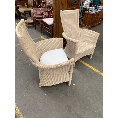 256 - A Pair of contemporary wicker weaved garden/ conservatory chairs.