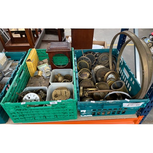 258 - Two crates of antique clock parts, includes workings, gears and clock faces