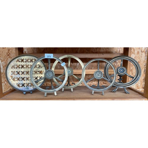 273 - Five antique brass fireplace trivet stands.