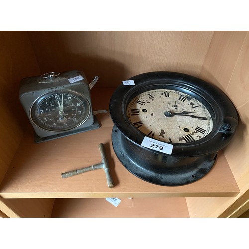 279 - Antique bulkhead style clock fitted within a bakelite body- in a working condition. Together with a ... 