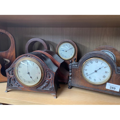 289 - A Shelf of antique wooden clock cases and mantel clocks.