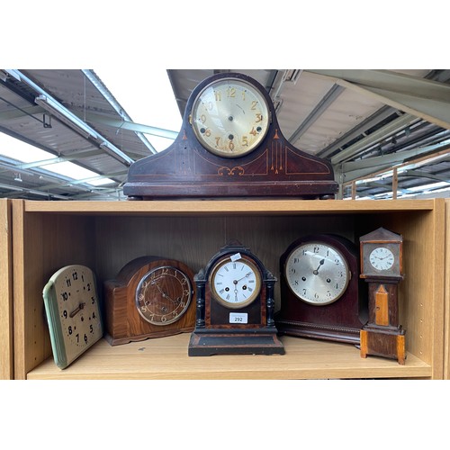 292 - A Shelf of mantel clocks and 8 day enamel clock & Apprentice grandfather clock