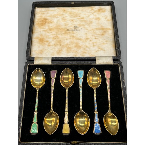 7 - A Boxed set of 6 Birmingham silver and enamel tea spoons produced by Walker & Hall.