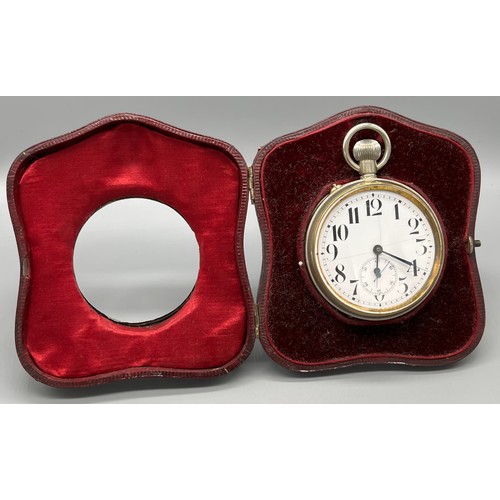 11 - A Birmingham silver ornate pocket watch travel case. together with a large pocket watch. [13x11cm]