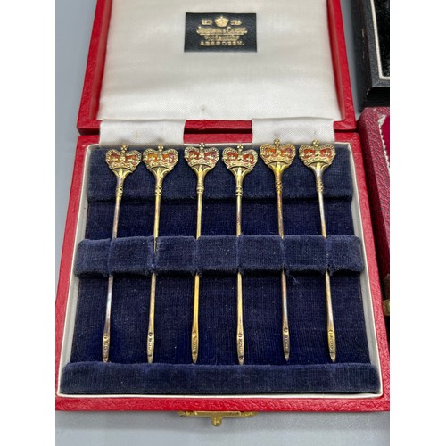 13 - Three boxed silver items. A Set of 6 Birmingham and enamel jubilee marked toothpicks produced by Adi... 