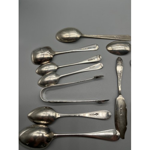 18 - A Collection of mixed Sheffield silver flatwares. includes Tongs, Knives and spoons. [Total weight- ... 