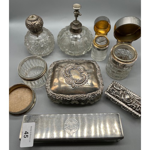 45 - A Collection of silver marked dressing table lidded preserve pots and perfume bottles.