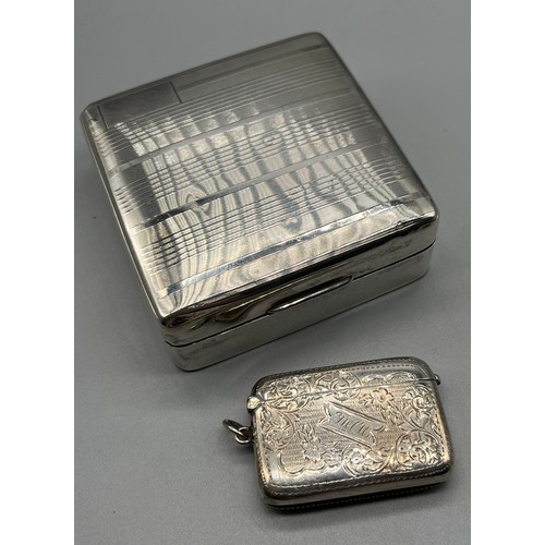 27 - Birmingham silver cigarette box together with an ornate Birmingham silver vesta case. [Box-3.2x8.6x8... 