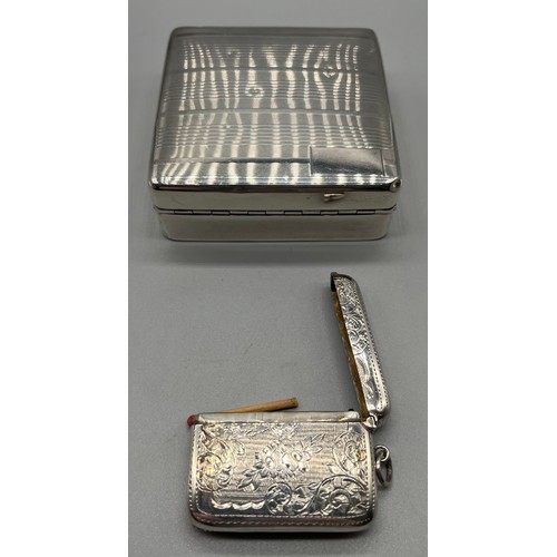 27 - Birmingham silver cigarette box together with an ornate Birmingham silver vesta case. [Box-3.2x8.6x8... 