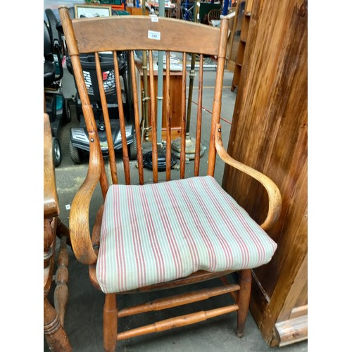 339 - Antique oak smokers arm chair, Curved back with spindle reed supports & bent wood oak arm rests.