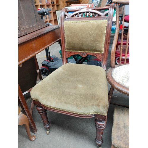 336 - Victorian parlour chair, scroll back, supported on turned legs and brass castors.