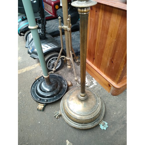 330 - Three antique rise and fall paraffin lamp bases. [Brass bodies]