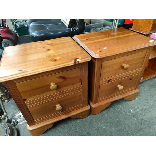 327 - A Pair of pine two drawer bedside chests.