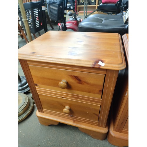 327 - A Pair of pine two drawer bedside chests.