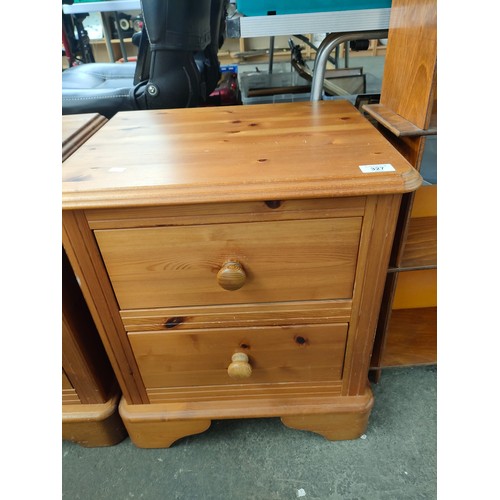 327 - A Pair of pine two drawer bedside chests.