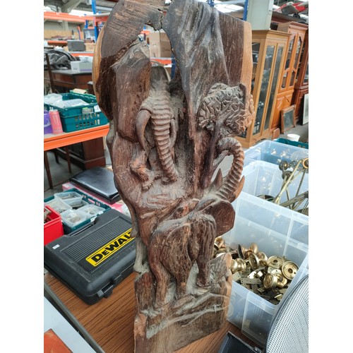 320 - A Large African wooden carving depicting figures and elephants. 2.5-3 foot in height.