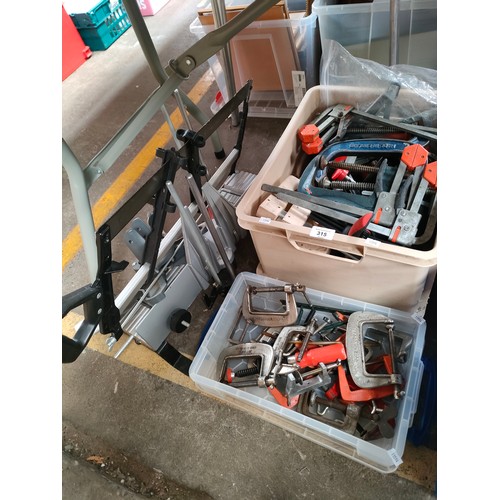 315 - Mitre saw and two boxes containing a large quantity of clamps and vice grips.